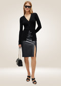 Black leather A-line pencil skirt with sleek silhouette and elegant mid-length design