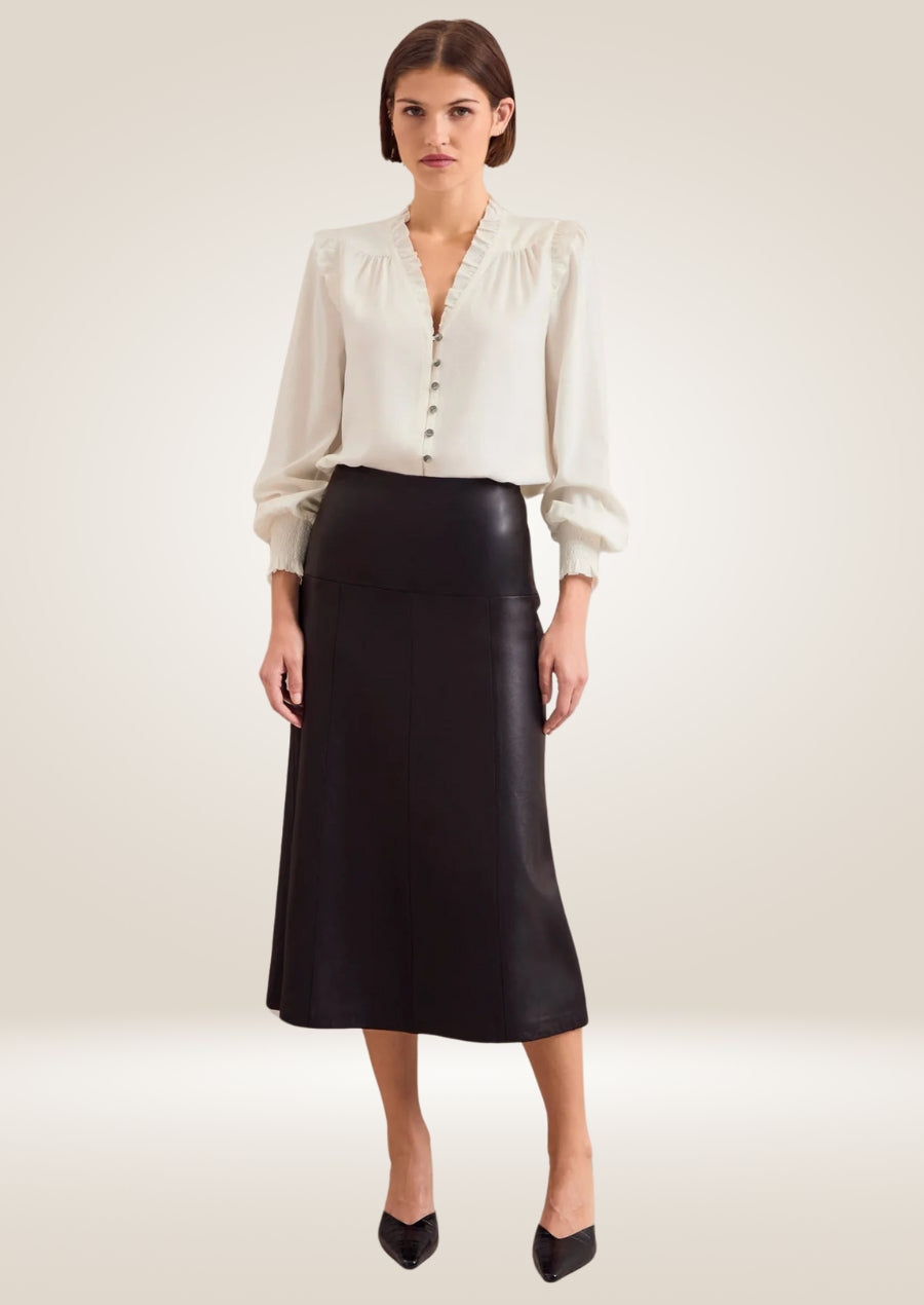 Black leather midi skirt with high waist and sleek tailored silhouette for modern style