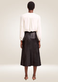 Premium black leather midi skirt offering refined stitching and timeless versatile appeal