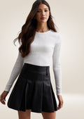 Black leather mini skirt with high waist and sleek tailored silhouette for modern styling