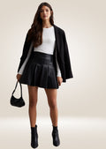 Stylish black leather mini skirt featuring smooth soft leather and clean polished finish