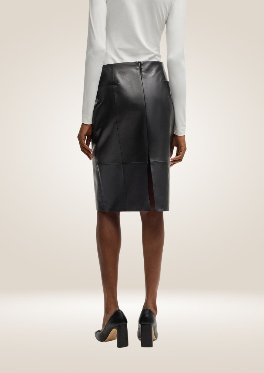 Classic black leather pencil skirt featuring refined stitching and sophisticated design