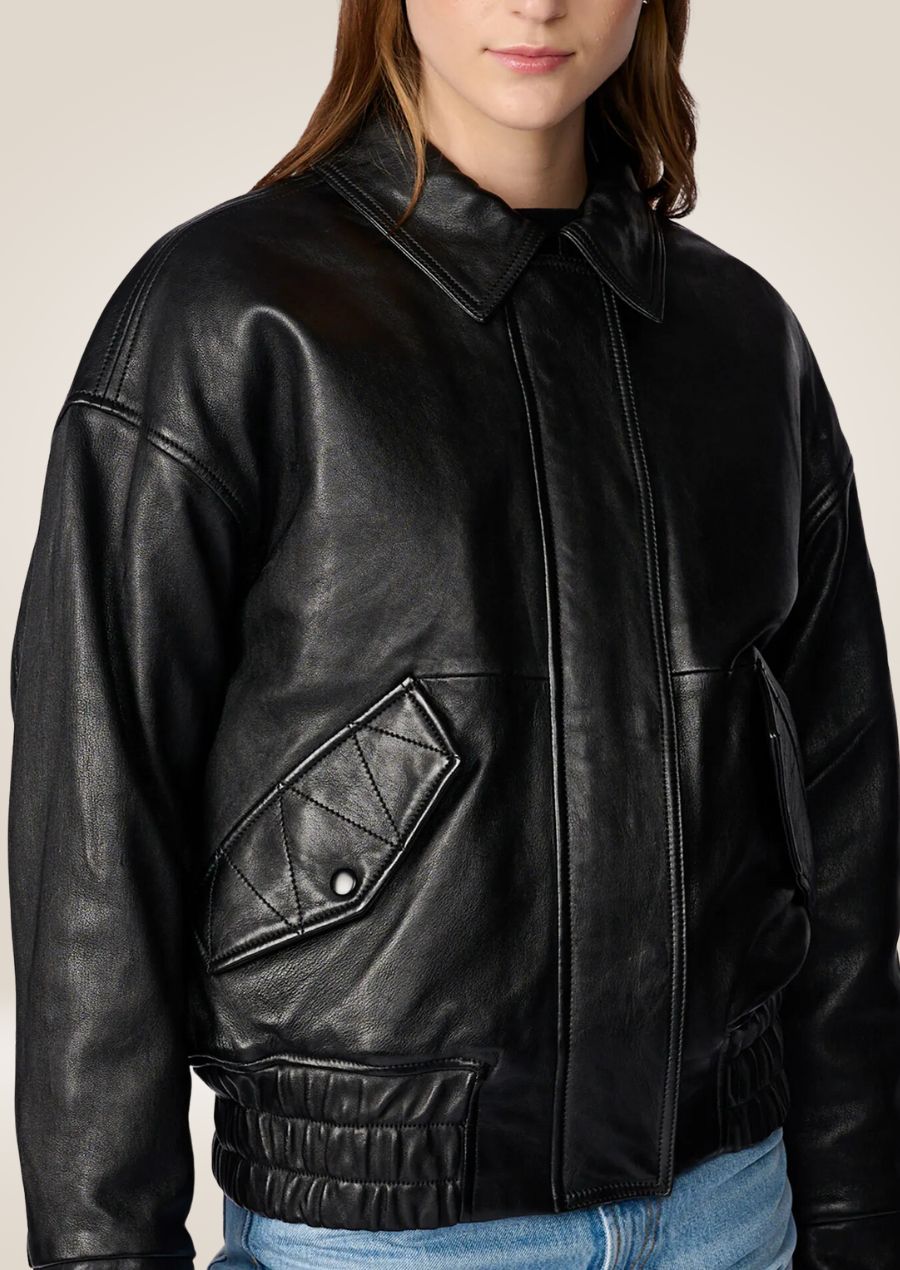 Women’s black oversized leather bomber jacket with zip closure