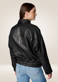 Classic women’s black leather bomber jacket with ribbed cuffs
