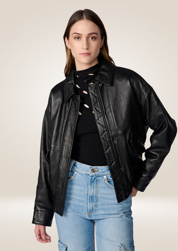 Women’s black oversized leather bomber jacket with zip closure