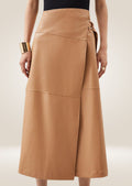 Camel leather wrap midi skirt with side tie closure and elegant minimalist silhouette