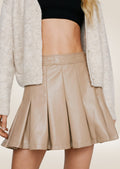Elegant cream leather pleated tennis skirt offering clean lines and polished silhouette
