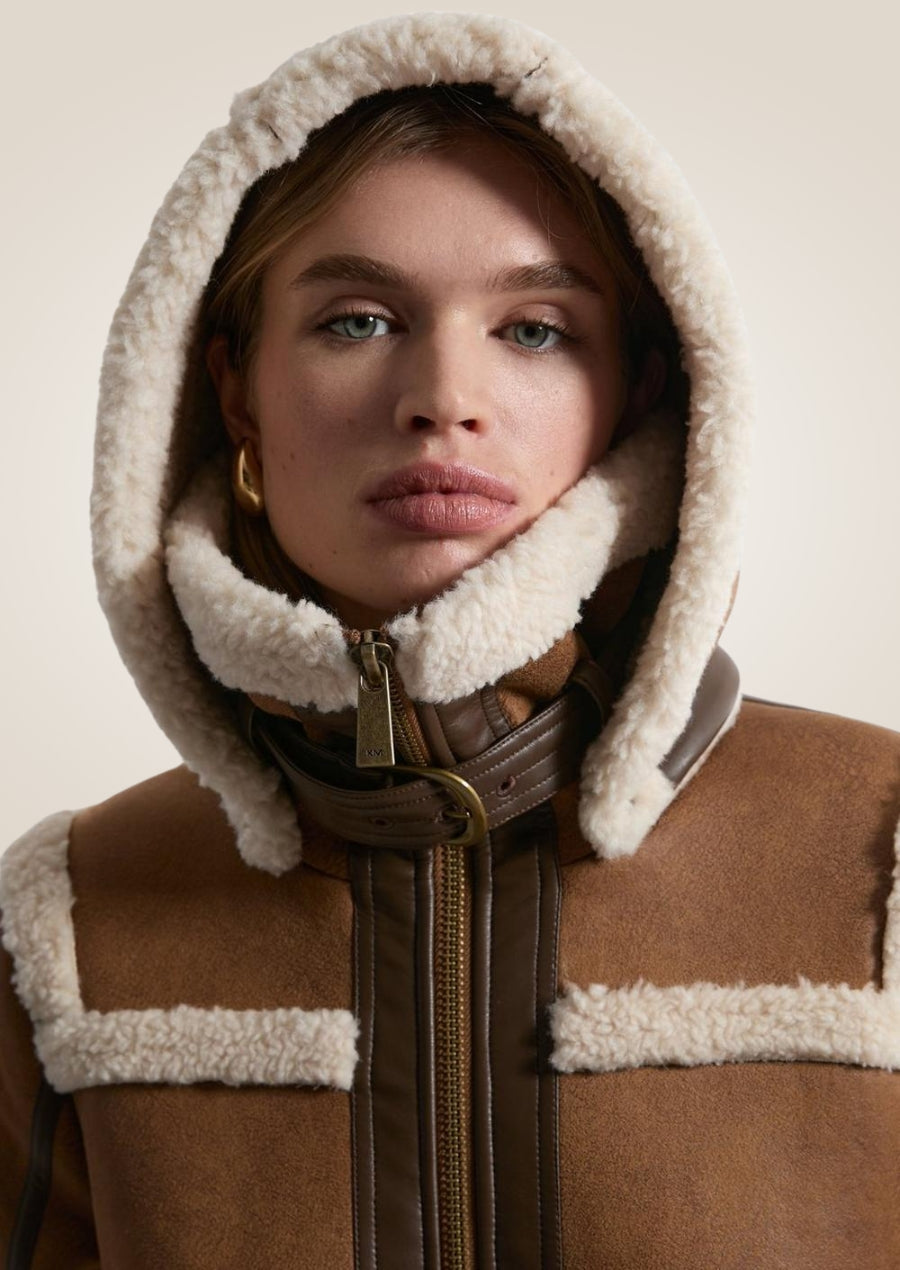 Shearling trim hooded leather midi coat with warm lining and elegant mid-length design