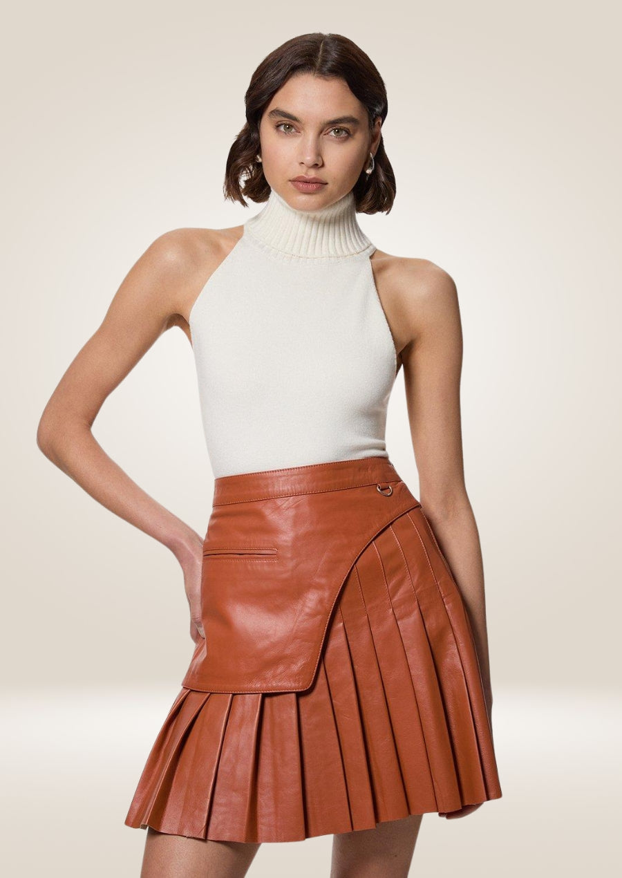 Tan leather pleated mini skirt with soft texture and elegant high-waisted short silhouette