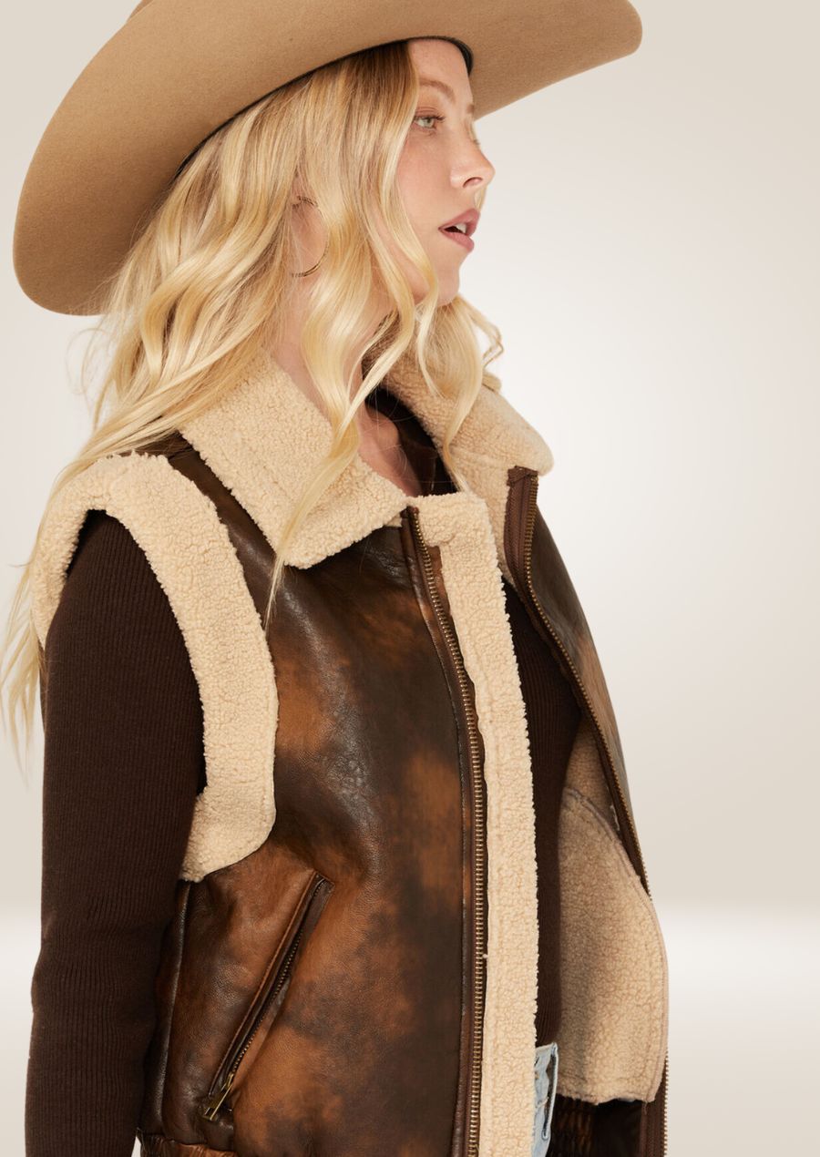 Women’s leather aviator sherpa vest with soft shearling lining and classic aviator style